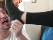 Lick Val's socks and feet while she laughs at him