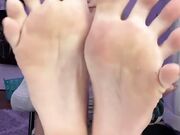 young blonde show and lick her soles feet