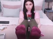 young brunette feet in socks then barefoot soles