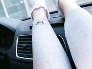 she shows off her cute white socks in the car