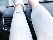 she shows off her cute white socks in the car