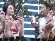 two women show soft soles in public