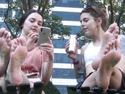 two women show soft soles in public