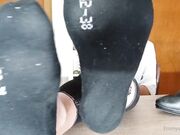 young german blonde show feet soles on table