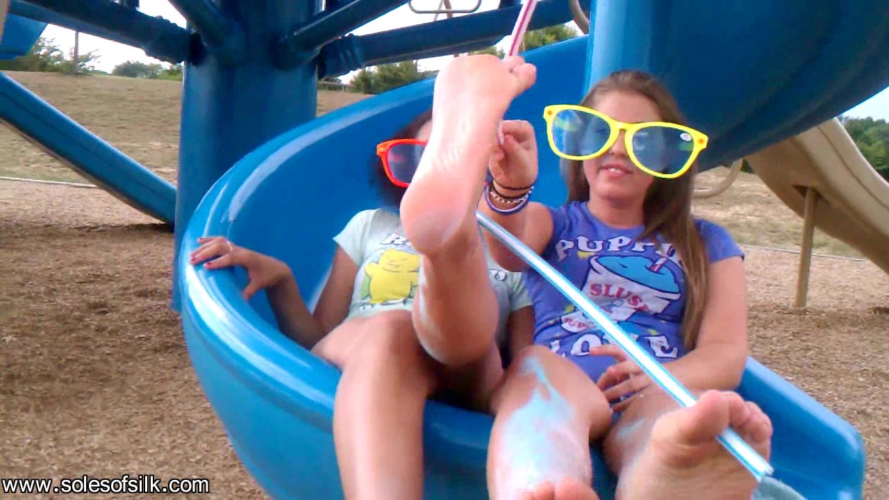 Soles of Silk playfully taunting on the slide