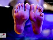 Charm with beautiful feet in sexy golden flip flops