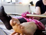 Wife footboard feet tickle from socks to bare