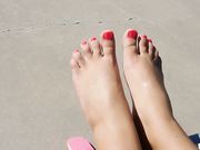 Anna showing her toes by the pool