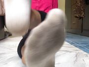 Asian Woman's So Smelly Socks And Barefeet