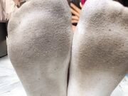 Asian Woman's So Smelly Socks And Barefeet