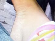 Sucking her toes and biting off her toenail