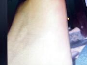 Sucking her toes and biting off her toenail