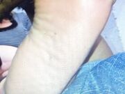 Sucking her toes and biting off her toenail