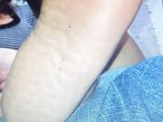 Sucking her toes and biting off her toenail