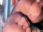 MistressLegs Goddess foot tease in black torn nylons opposite a panoramic window