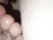 The teen boy lickling his foots